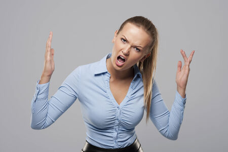 Portrait of shouting blonde businesswomanの写真素材