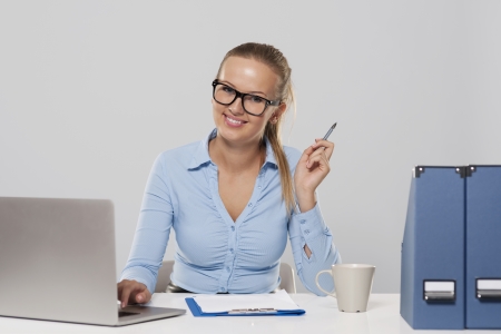Portrait of smiling woman during the office work の写真素材
