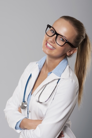 Cute young female medical student smiling の写真素材