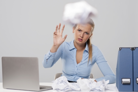 Tired woman throwing out office documents 
の写真素材