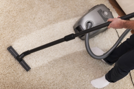 Close up of vacuuming a carpet の写真素材