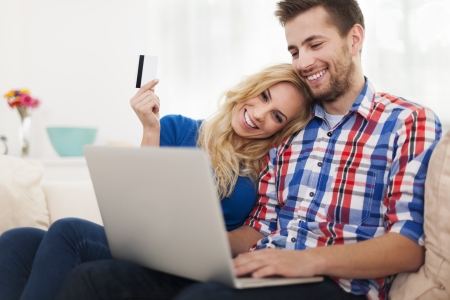 Young couple paying online by credit card の写真素材