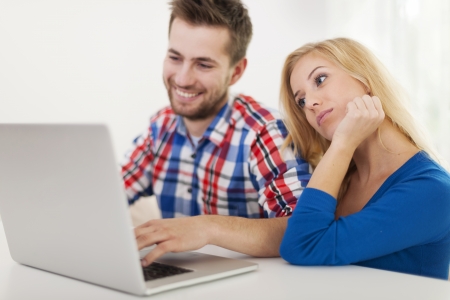 Portrait of couple with contemporary laptop の写真素材