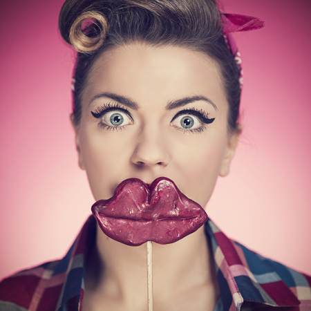 Beautiful pin-up girl with funny mouth 
の写真素材