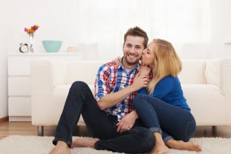 Affectionate couple spending time together at homeの写真素材