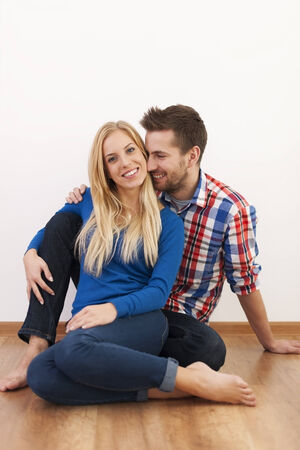 Happy couple flirting together at home の写真素材