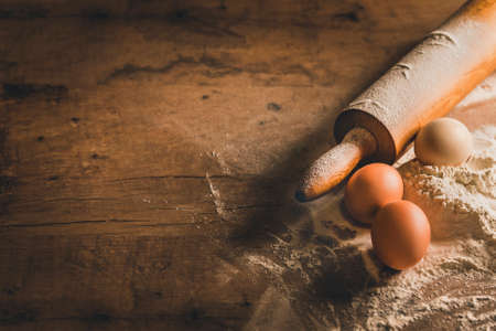 Wooden table with baking equipmentの写真素材