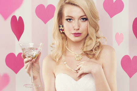Sexy luxury woman holding glass with margarita の写真素材