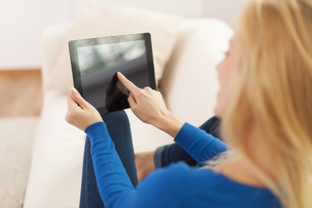 Close up of woman using digital tablet の写真素材