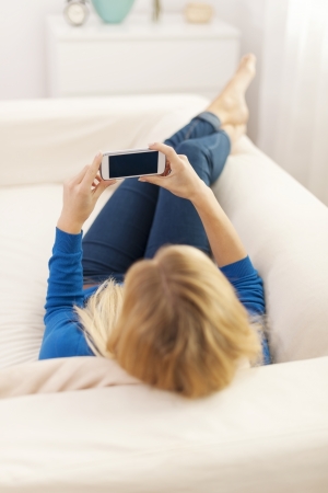 Time to relaxing with mobile phone の写真素材