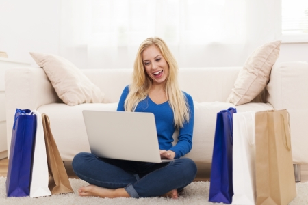 Happy woman from online shopping の写真素材
