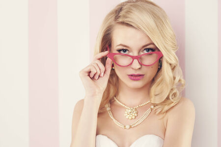 Sexy elegant woman wearing cat's eye glassesの写真素材