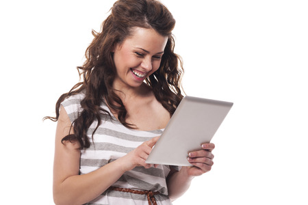 Happy woman using digital tablet の写真素材