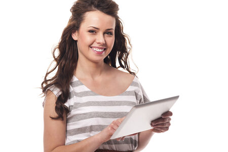 Casual woman using digital tablet の写真素材