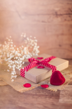 Valentine's gift and hearts on wood の写真素材