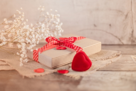 Valentine's gift and hearts decorations on wood の写真素材
