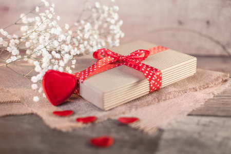 Valentine's gift and hearts on wood の写真素材