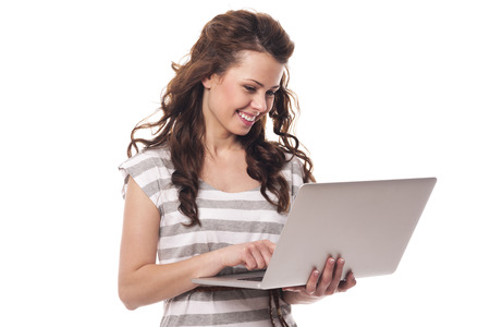 Happy young woman using laptop
の写真素材