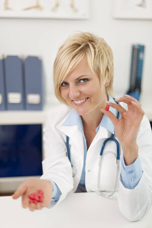 Smiling blonde doctor with medical pills
の写真素材