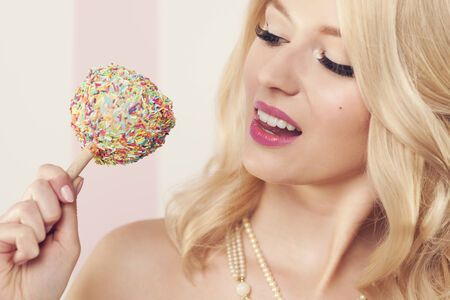 Close up of passion elegant woman with candy 
の写真素材
