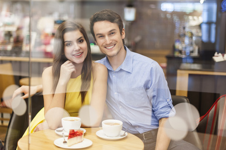 Portrait of beautiful couple in cafe の写真素材