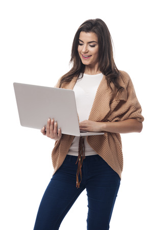 Beautiful woman staying connected with internet の写真素材