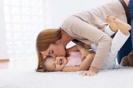 Mother playing with her baby の写真素材