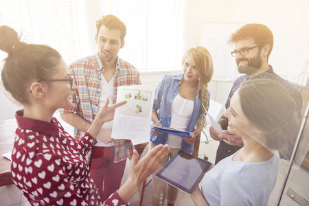 Businesswoman with team having a discussion