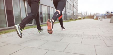 Close up of two runners in the cityの写真素材