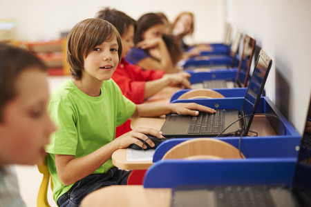 Pupils sitting at the computer science lesson
