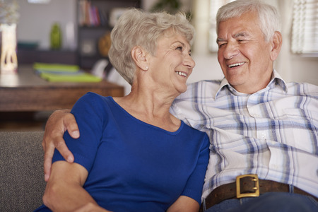 Happy senior couple on te sofa