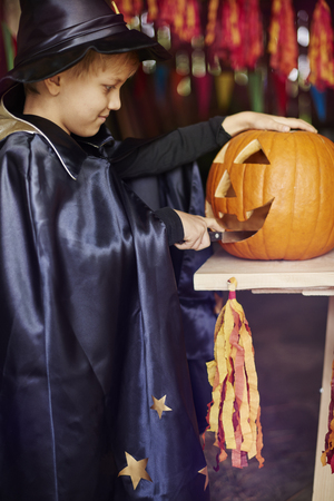 My jack o'lantern is almost doneの写真素材