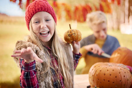 Carving a pumpkin demands your creativityの写真素材