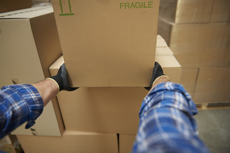 Work at warehouse requires a large strengthの写真素材