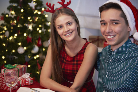 Brother and sister posing at the tableの写真素材