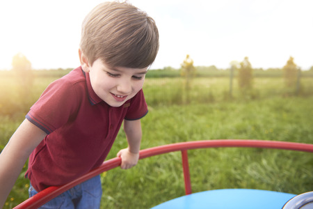 Cute little boy at the playgroundの写真素材