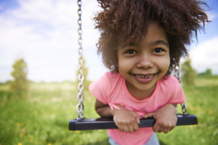 Little girl on the playgroundの写真素材