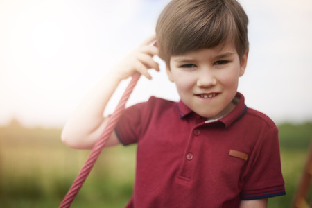 Portrait of little boy at the playgroundの写真素材