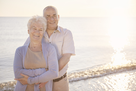 Senior man and woman embracing on the beach
の写真素材