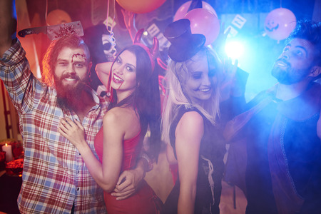 People dancing in the smoke