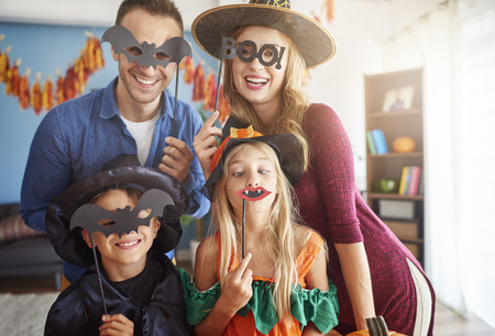 Family has fun in Halloween timeの写真素材