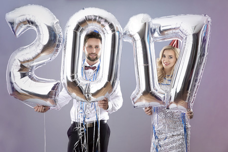 Couple with big balloons on New Yearの写真素材