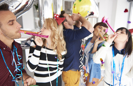 People having fun at the office partyの写真素材