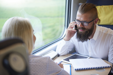 Man talking by mobile phone during the travel