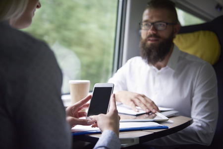 Mobilephone in hands of businesswoman