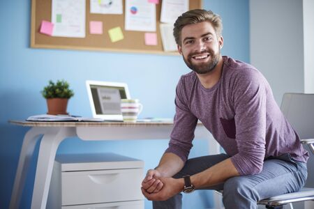 Man sitting in his home officeの写真素材