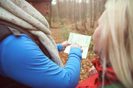 Man pointing on the paper mapの写真素材