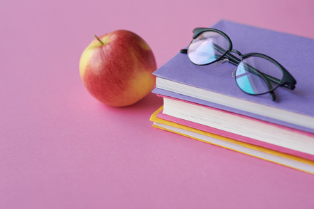 Front shot of apple and work toolsの写真素材