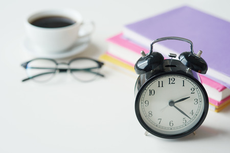 Old fashioned alarm clock in the main plan 