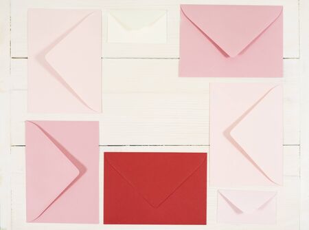 Directly above shot of five red envelopes